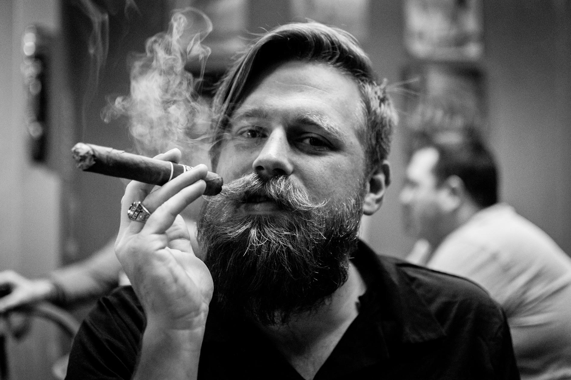 Man With Beard Holding Cigar