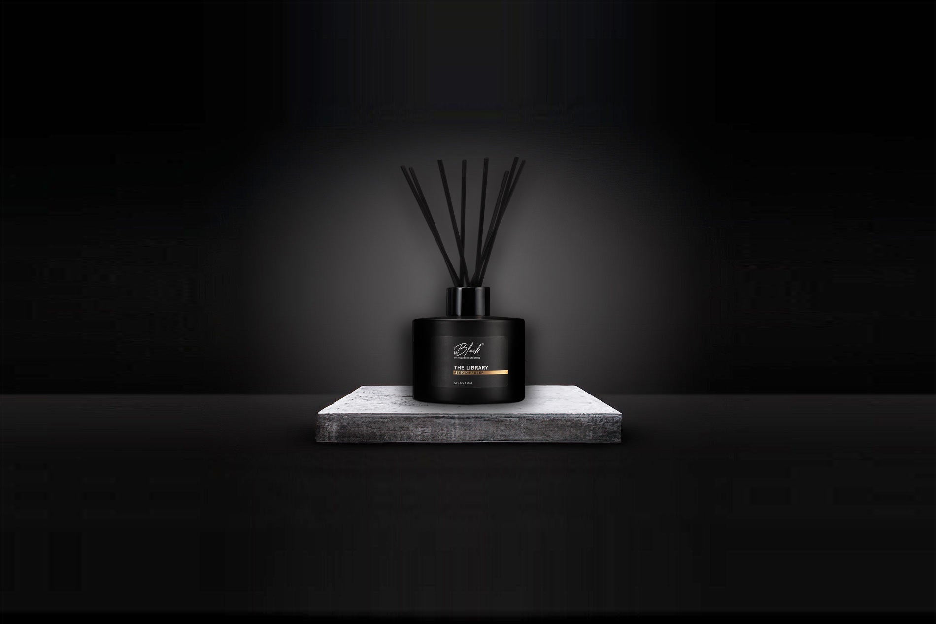 Reed Diffuser On Grey Stone With Black Background