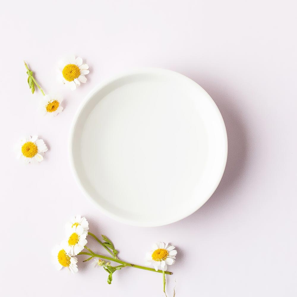 Chamomile Flowers Around A Bowl